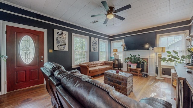 2635 Gladys Ave, Beaumont, TX 77701 - living area with visible vents, ornamental molding, and wood finished floors