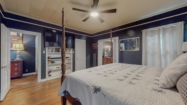 2635 Gladys Ave, Beaumont, TX 77701 - bedroom featuring baseboards, wood finished floors, a ceiling fan, and crown molding