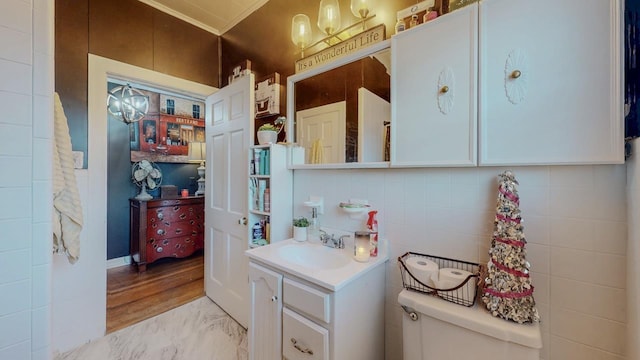 2635 Gladys Ave, Beaumont, TX 77701 - bathroom with vanity, toilet, and marble finish floor