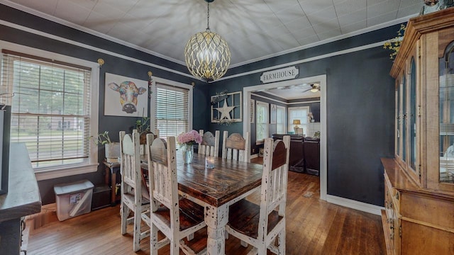 2635 Gladys Ave, Beaumont, TX 77701 - dining space featuring hardwood / wood-style flooring, a healthy amount of sunlight, and a notable chandelier