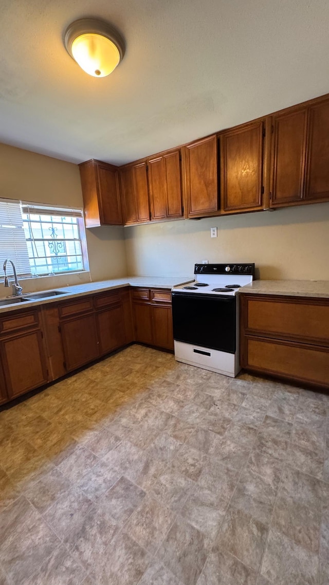 kitchen with sink and range with electric cooktop