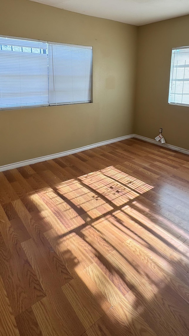 spare room featuring hardwood / wood-style flooring