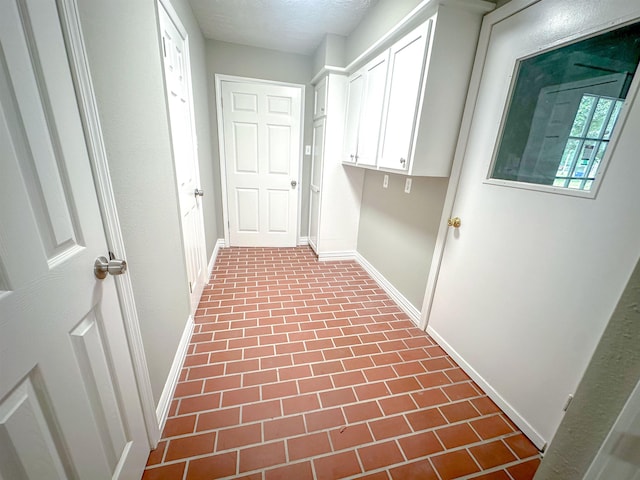 3640 Whippoorwill St, Orange, TX 77630 - laundry room featuring baseboards and dark tile patterned floors