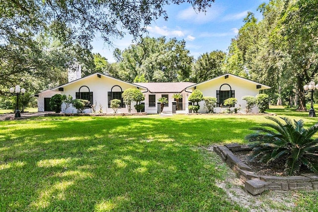 3640 Whippoorwill St, Orange, TX 77630 - ranch-style house featuring a front yard and an attached garage