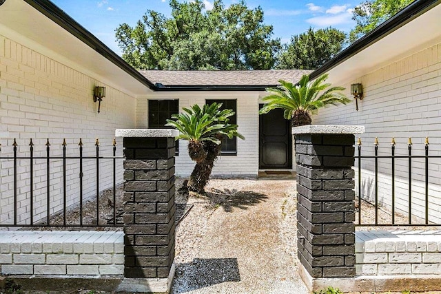 3640 Whippoorwill St, Orange, TX 77630 - doorway to property featuring brick siding