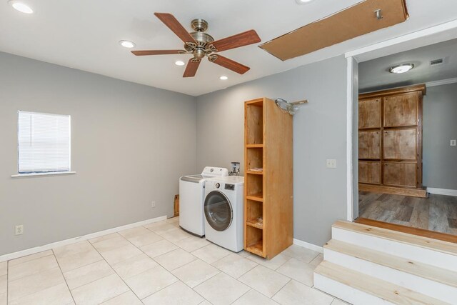 clothes washing area with ceiling fan, light tile patterned floors, and independent washer and dryer