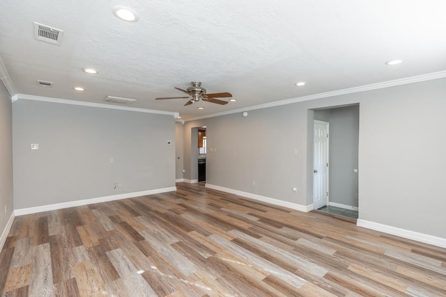 empty room with ceiling fan, crown molding, a textured ceiling, and light wood-type flooring