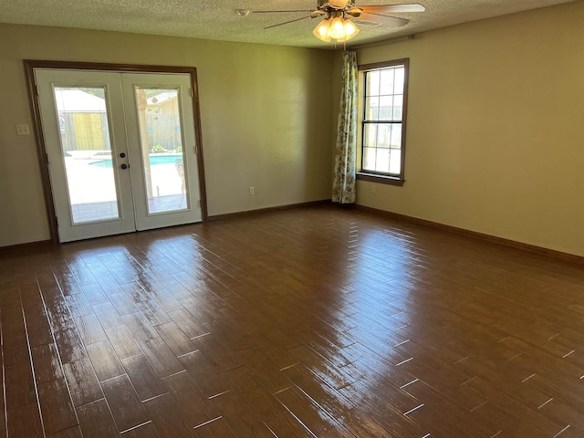 unfurnished room with ceiling fan, french doors, and dark hardwood / wood-style floors