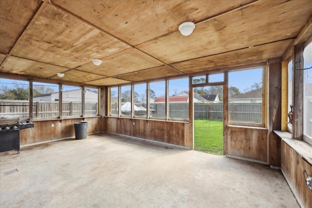 unfurnished sunroom featuring wooden ceiling