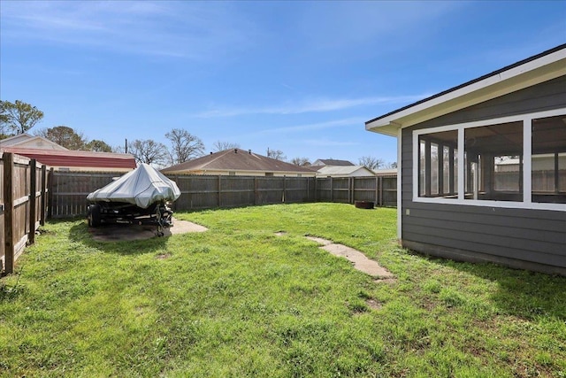 view of yard with a sunroom