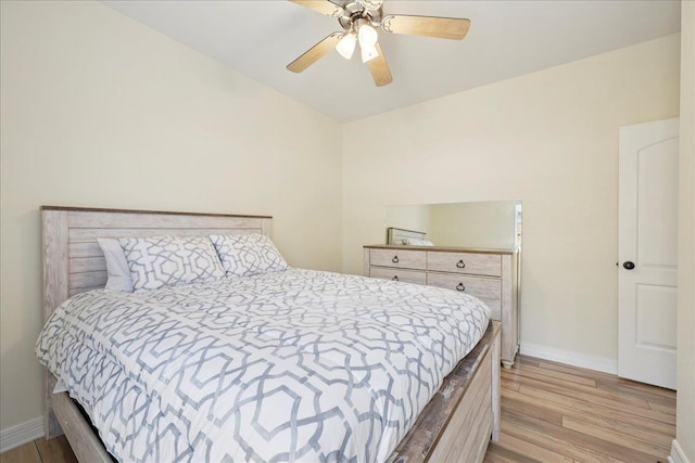 7820 N Windemere Dr, Beaumont, TX 77713 - bedroom with light wood-style flooring, baseboards, and a ceiling fan