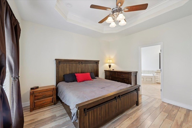 7820 N Windemere Dr, Beaumont, TX 77713 - bedroom with ornamental molding, light wood finished floors, a raised ceiling, baseboards, and connected bathroom