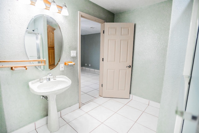 bathroom featuring sink and tile patterned flooring