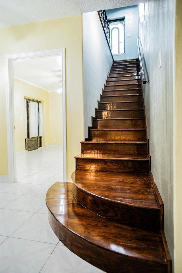 stairway with tile patterned flooring