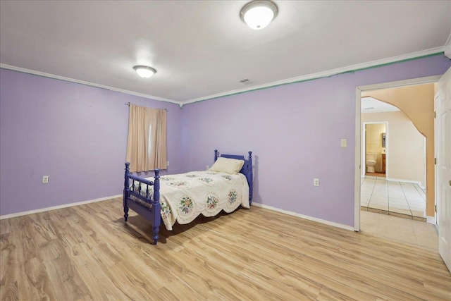 1035 Chamberlin Dr, Beaumont, TX 77707 - bedroom featuring crown molding, light wood finished floors, visible vents, and baseboards