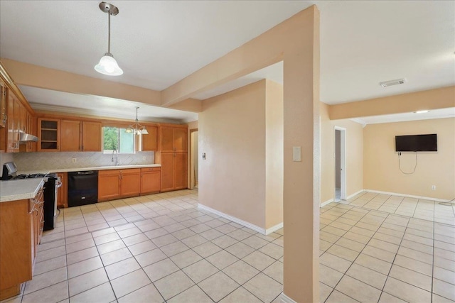 1035 Chamberlin Dr, Beaumont, TX 77707 - kitchen featuring tasteful backsplash, light tile patterned floors, black dishwasher, light countertops, and stainless steel range with gas cooktop