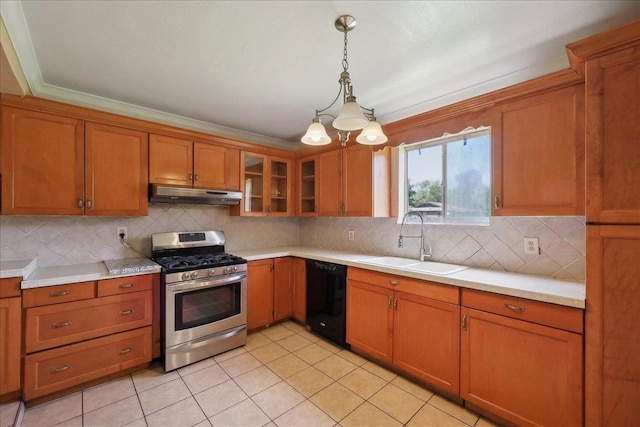 1035 Chamberlin Dr, Beaumont, TX 77707 - kitchen with stainless steel gas range, a sink, under cabinet range hood, brown cabinetry, and dishwasher