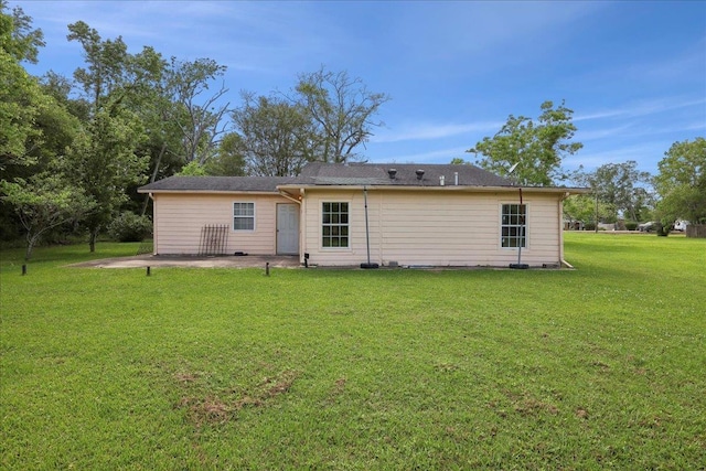 1035 Chamberlin Dr, Beaumont, TX 77707 - rear view of property featuring a yard and a patio area