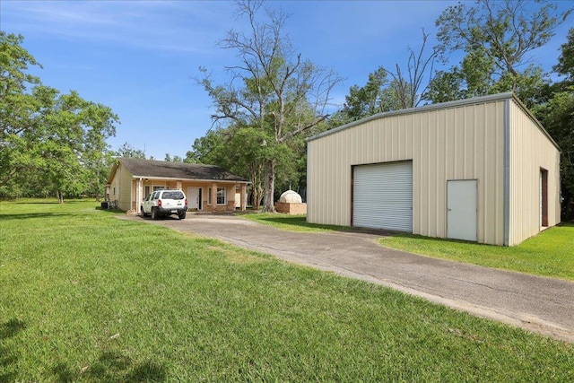 1035 Chamberlin Dr, Beaumont, TX 77707 - detached garage featuring driveway