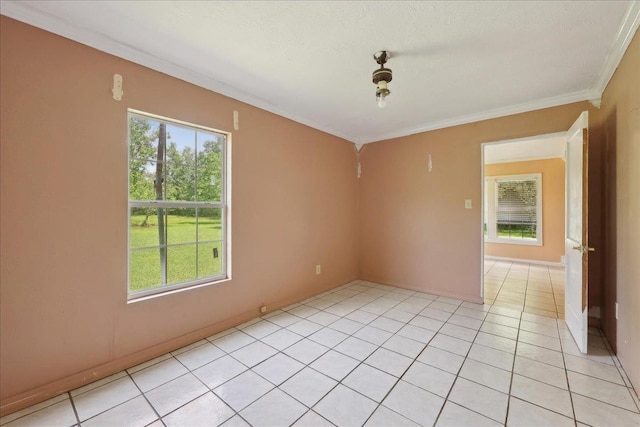 1035 Chamberlin Dr, Beaumont, TX 77707 - spare room featuring light tile patterned floors, ornamental molding, and baseboards
