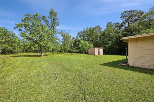 1035 Chamberlin Dr, Beaumont, TX 77707 - view of yard featuring a storage unit and an outdoor structure