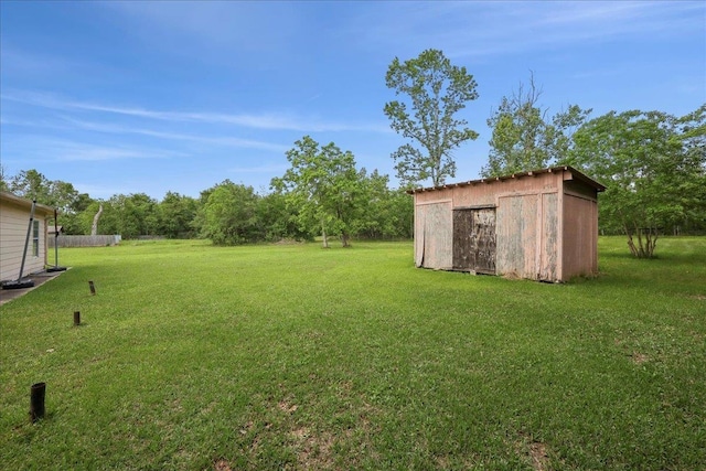 1035 Chamberlin Dr, Beaumont, TX 77707 - view of yard with a storage shed and an outdoor structure
