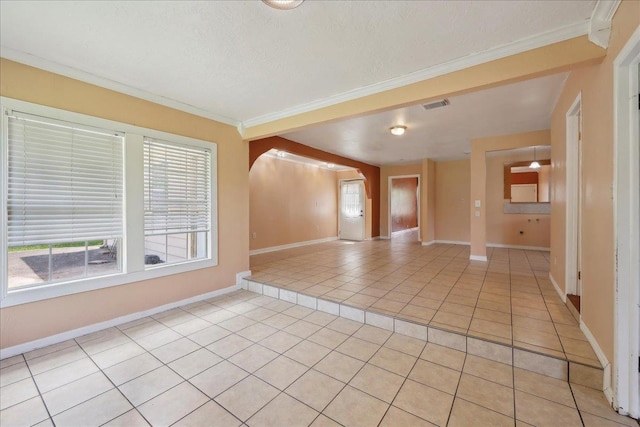 1035 Chamberlin Dr, Beaumont, TX 77707 - spare room with light tile patterned floors, visible vents, crown molding, and baseboards