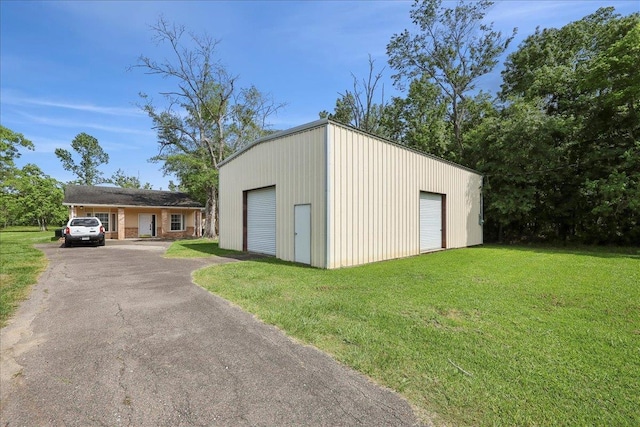 1035 Chamberlin Dr, Beaumont, TX 77707 - view of outbuilding with an outdoor structure and driveway