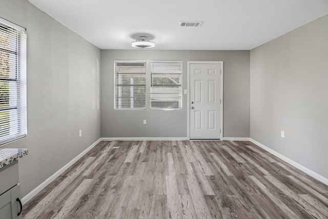 unfurnished room featuring light hardwood / wood-style floors