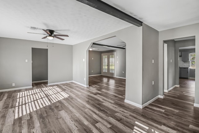 spare room with ceiling fan, dark hardwood / wood-style floors, and french doors