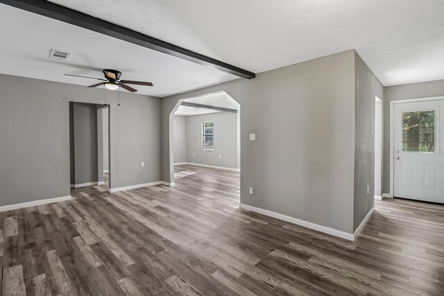 interior space with beam ceiling, ceiling fan, and dark wood-type flooring