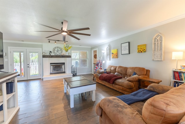 310 Medford Ln, Vidor, TX 77662 - living room with french doors, wood finished floors, ceiling fan, and ornamental molding