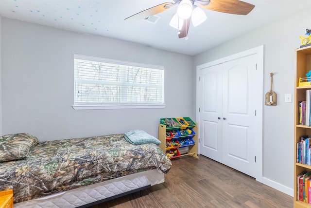 310 Medford Ln, Vidor, TX 77662 - bedroom with a closet, visible vents, baseboards, ceiling fan, and wood finished floors