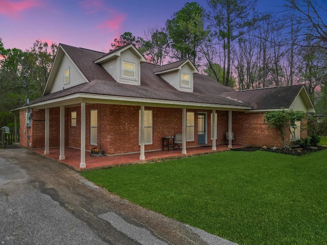 310 Medford Ln, Vidor, TX 77662 - view of front of home with brick siding and a front lawn