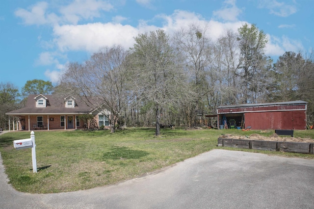 310 Medford Ln, Vidor, TX 77662 - view of yard featuring a pole building and an outbuilding