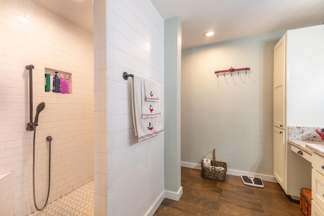 310 Medford Ln, Vidor, TX 77662 - full bath featuring recessed lighting, vanity, baseboards, and a walk in shower