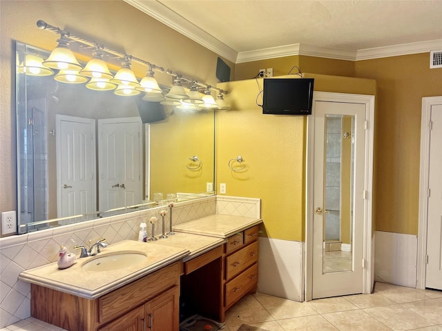 bathroom featuring tile patterned flooring, vanity, and ornamental molding