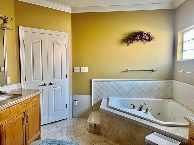 bathroom featuring tile patterned floors, vanity, a relaxing tiled tub, and ornamental molding