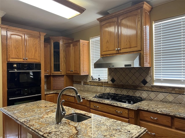 kitchen with black appliances, crown molding, sink, range hood, and light stone counters