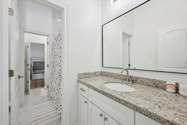 14990 Michelle Ln, Beaumont, TX 77713 - bathroom with marble look tile flooring, vanity, and curtained shower