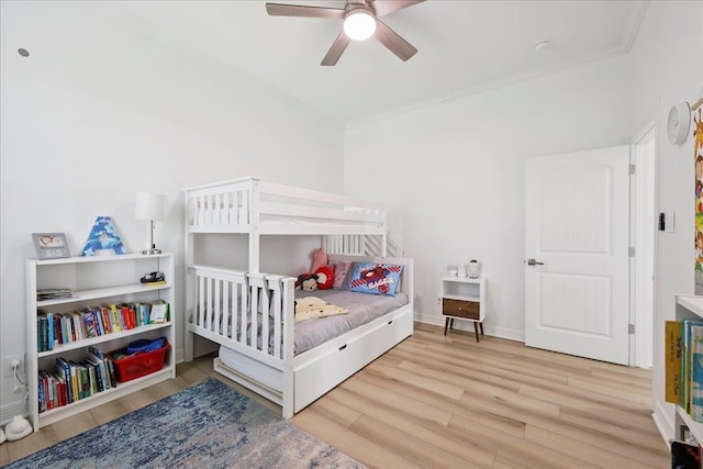 14990 Michelle Ln, Beaumont, TX 77713 - bedroom with wood finished floors, crown molding, ceiling fan, and baseboards