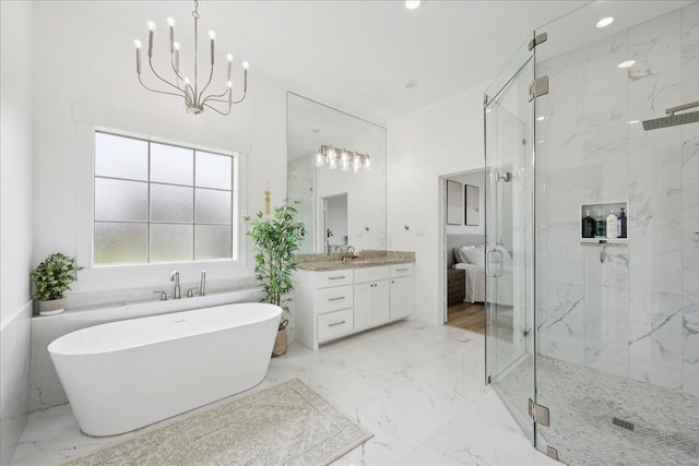 14990 Michelle Ln, Beaumont, TX 77713 - bathroom featuring marble tiled floors, a freestanding bath, a marble finish shower, vanity, and recessed lighting