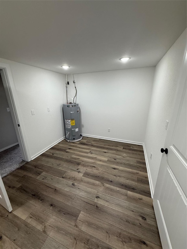 interior space featuring dark hardwood / wood-style flooring and water heater