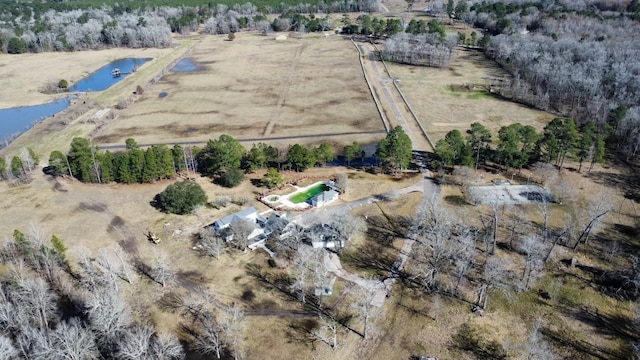 birds eye view of property with a water view and a rural view