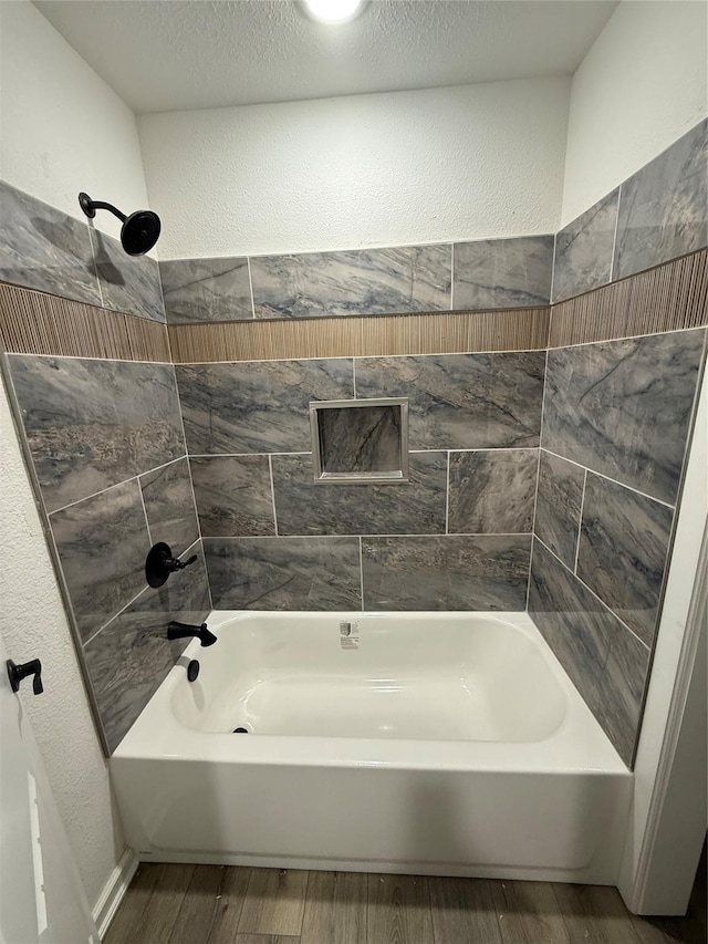 bathroom featuring shower / bathing tub combination and wood-type flooring