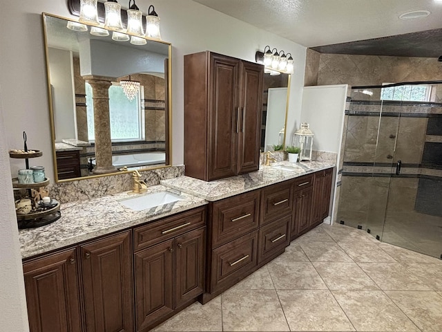 bathroom featuring tile patterned floors, vanity, and independent shower and bath