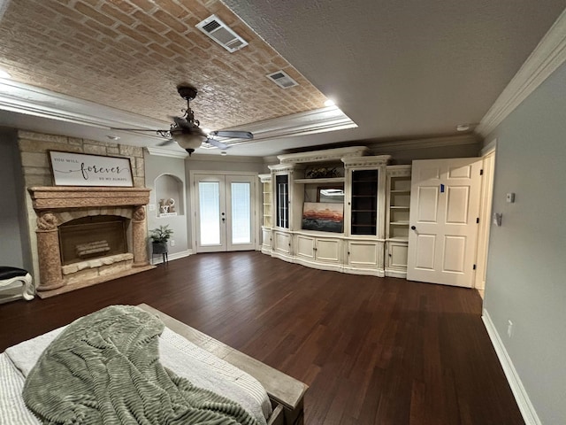 unfurnished living room featuring ceiling fan, french doors, wood-type flooring, brick ceiling, and ornamental molding