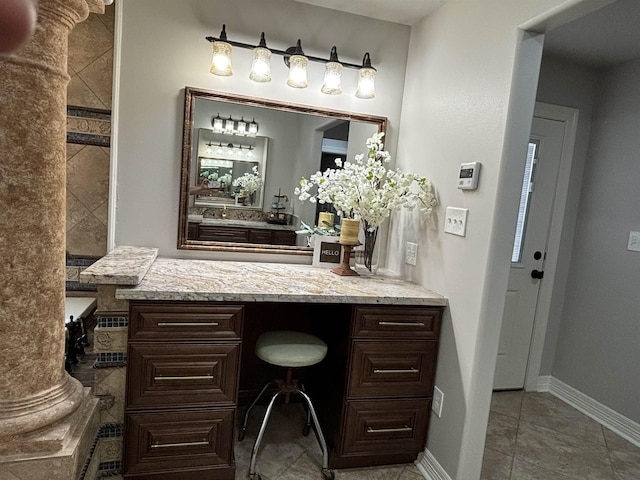 bathroom with tile patterned flooring and vanity