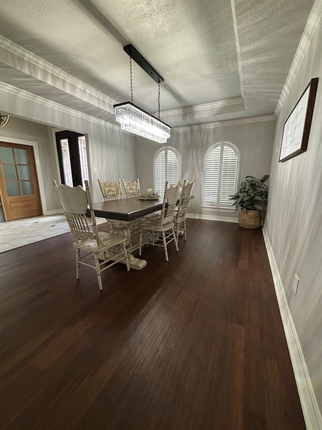 unfurnished dining area with plenty of natural light, dark wood-type flooring, and ornamental molding