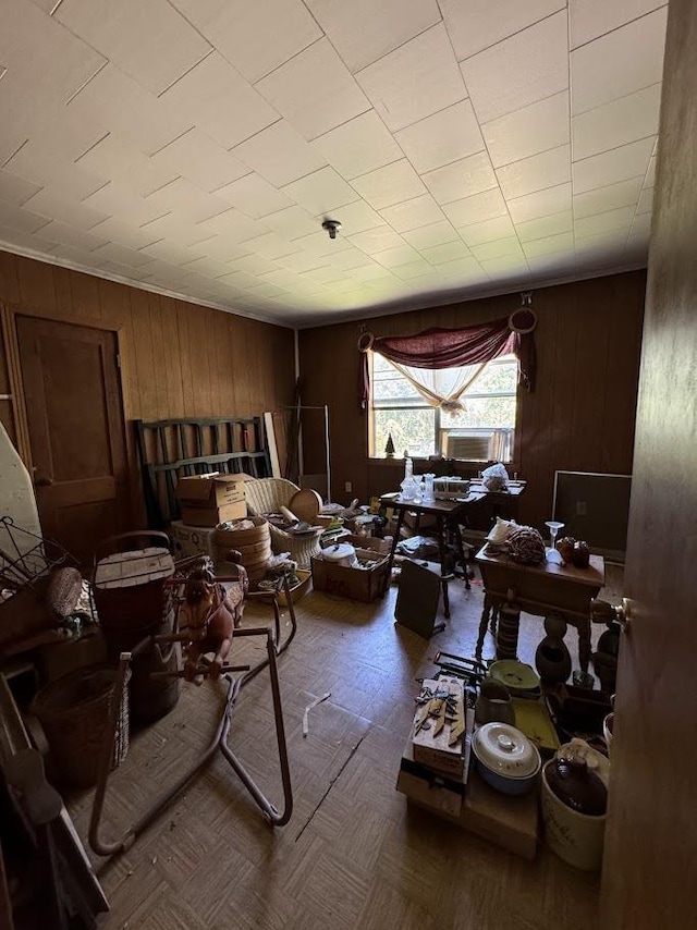 miscellaneous room with wood walls